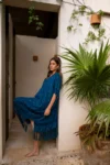 Woman wearing Enseada Navy dress
