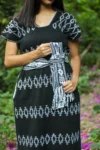 Woman wearing Universo black mini dress