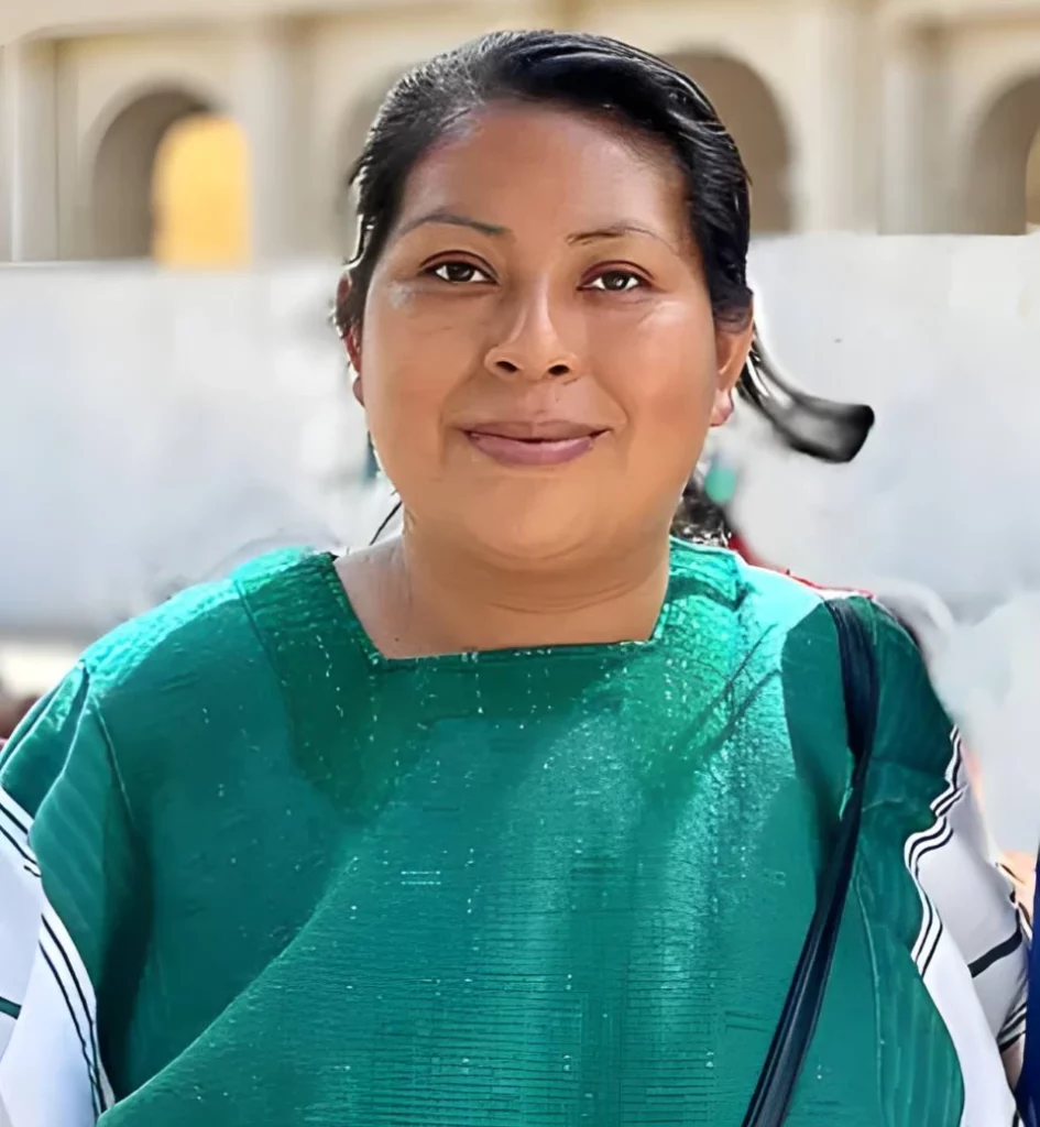 Woman Artesana wearing a green top 
