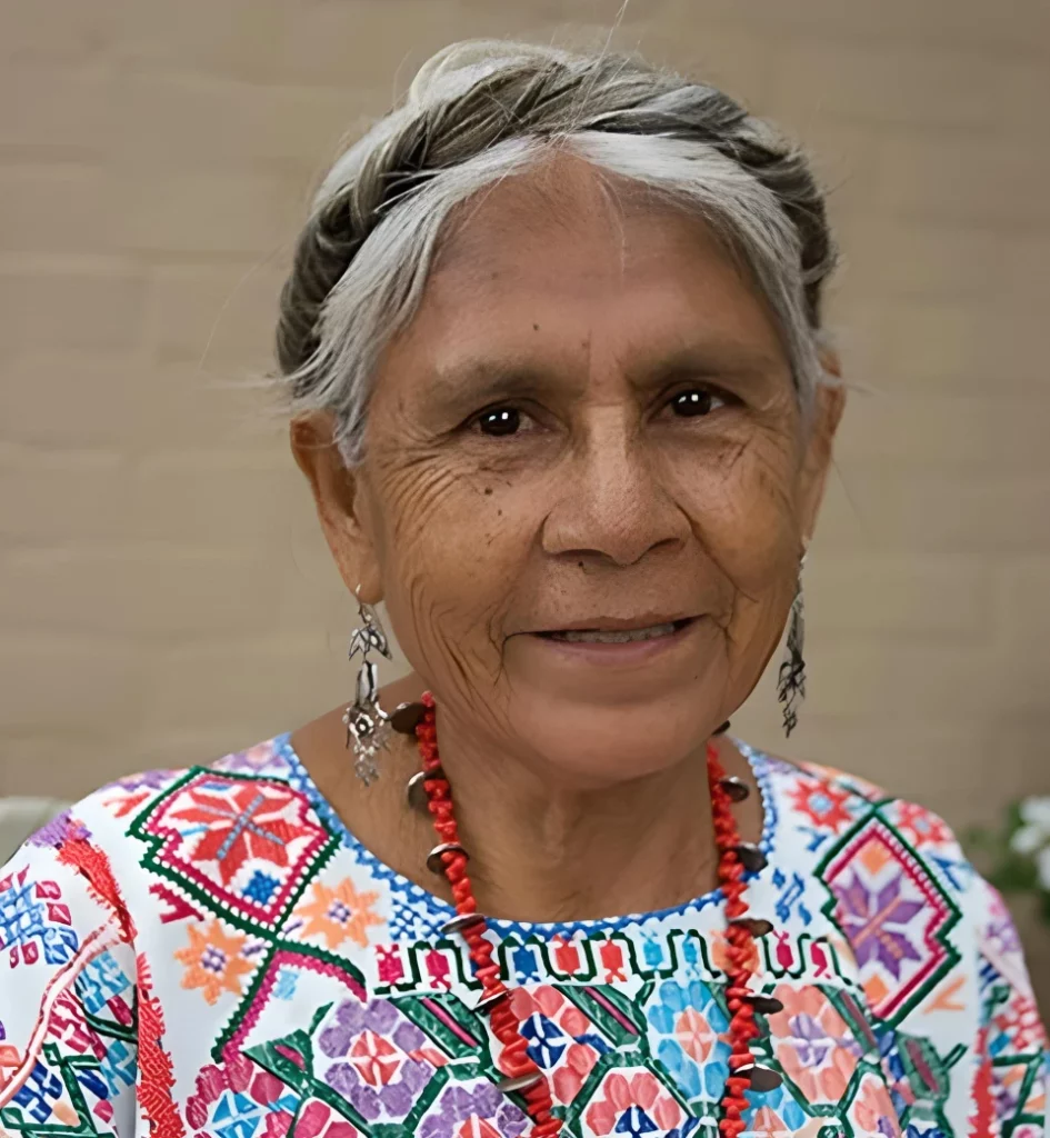Woman wearing white multicolor top in chiapas