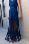 Caribe 2 Close-up of the Caribe Blue Maxi Dress showing handwoven fringe detail at the shoulders and waist with delicate artisan texture.