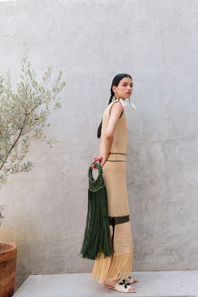 Model carrying the Maria Fringe Bag with the Orquidea Crochet Maxi Dress.