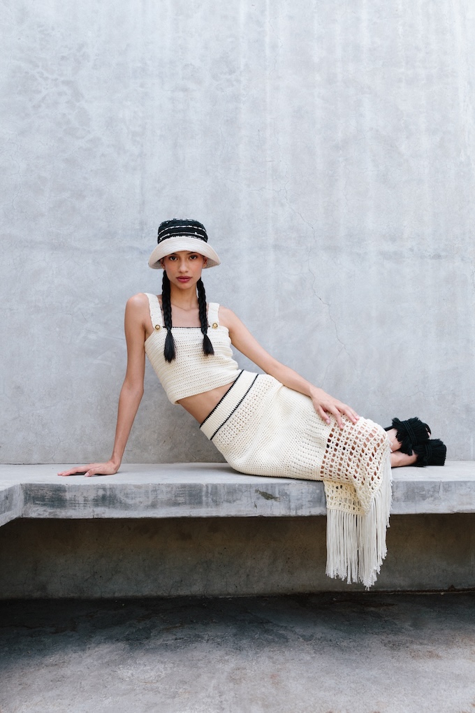 Model wears the Tequila crochet midi skirt with the matching crop top. Handwoven texture and fringe shown in movement.